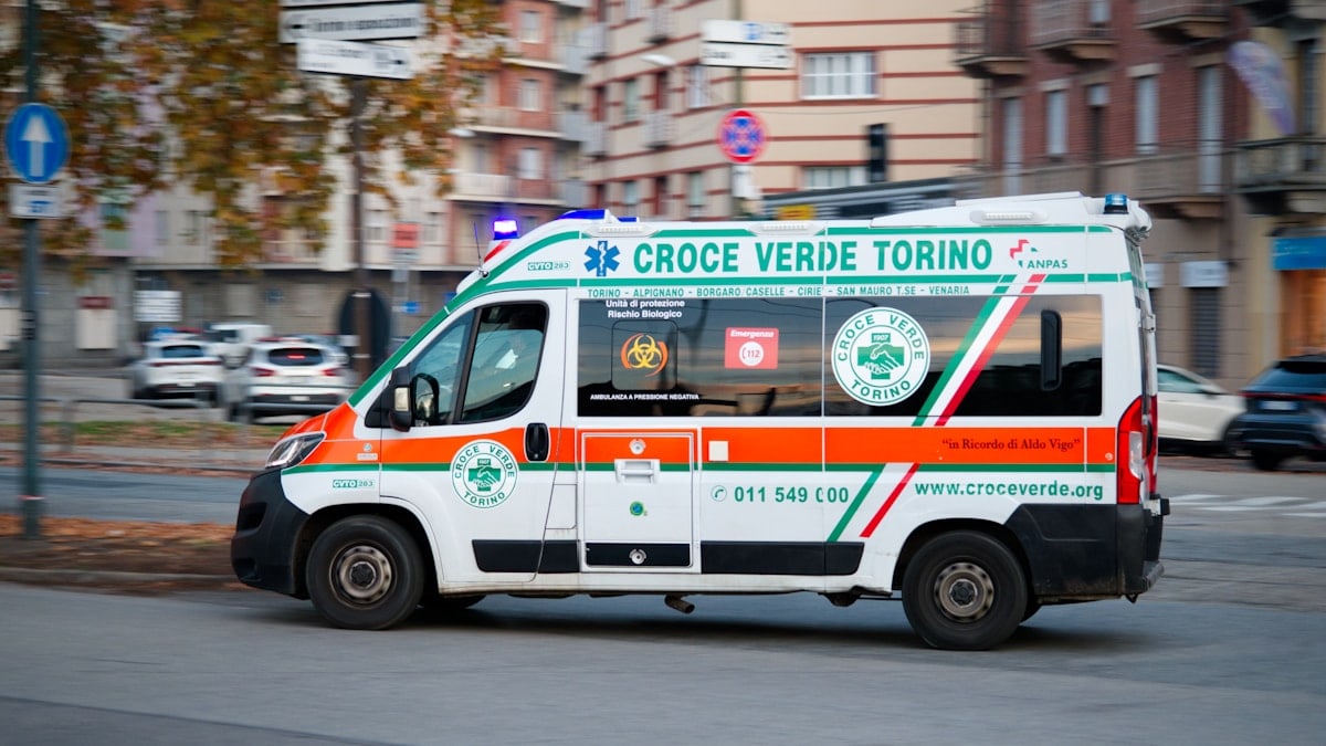 Ambulance driving down a city street